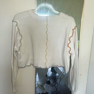 While multi color stitched sweater . Half sweater